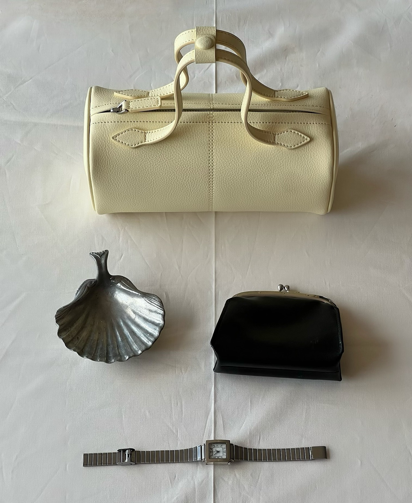 Freja bag surrounded by chic accessories.