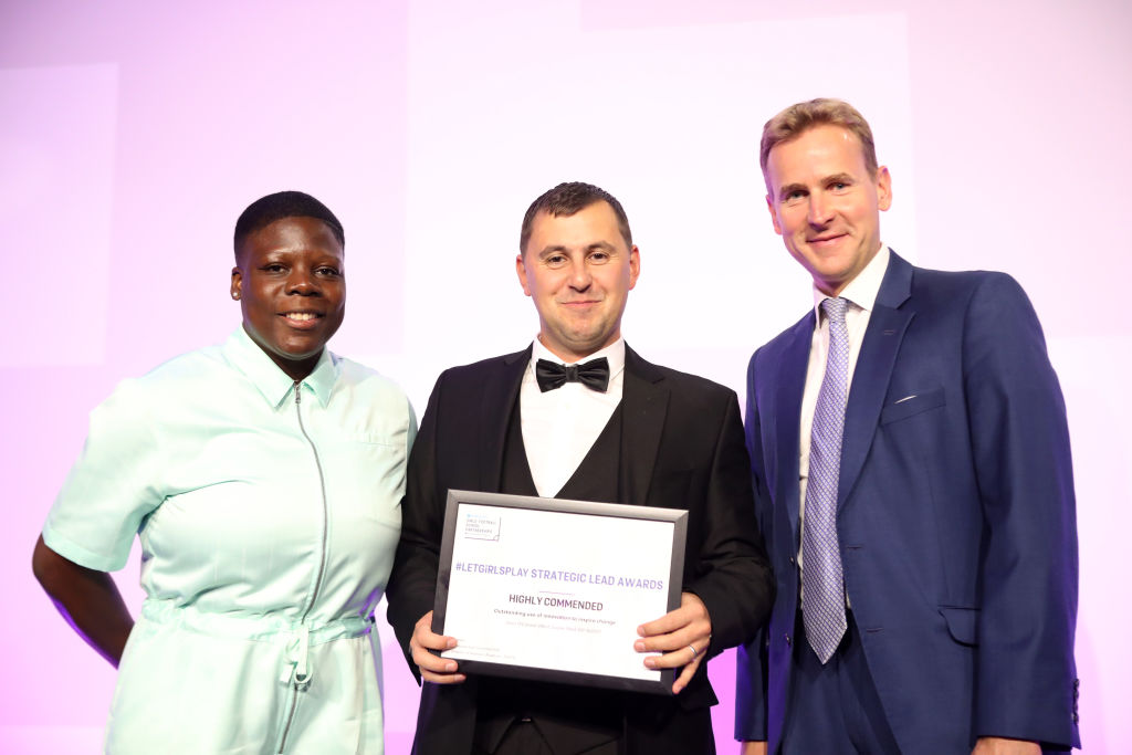 BIRMINGHAM, ENGLAND - SEPTEMBER 29: Sean O'Connor receives the highly commended award for the Outstanding use of innovation to inspire change presented by James Kendall and Eartha Pond during the Strategic Lead Awards at Villa Park on September 29, 2022 in Birmingham, England. (Photo by Morgan Harlow - The FA/The FA via Getty Images)