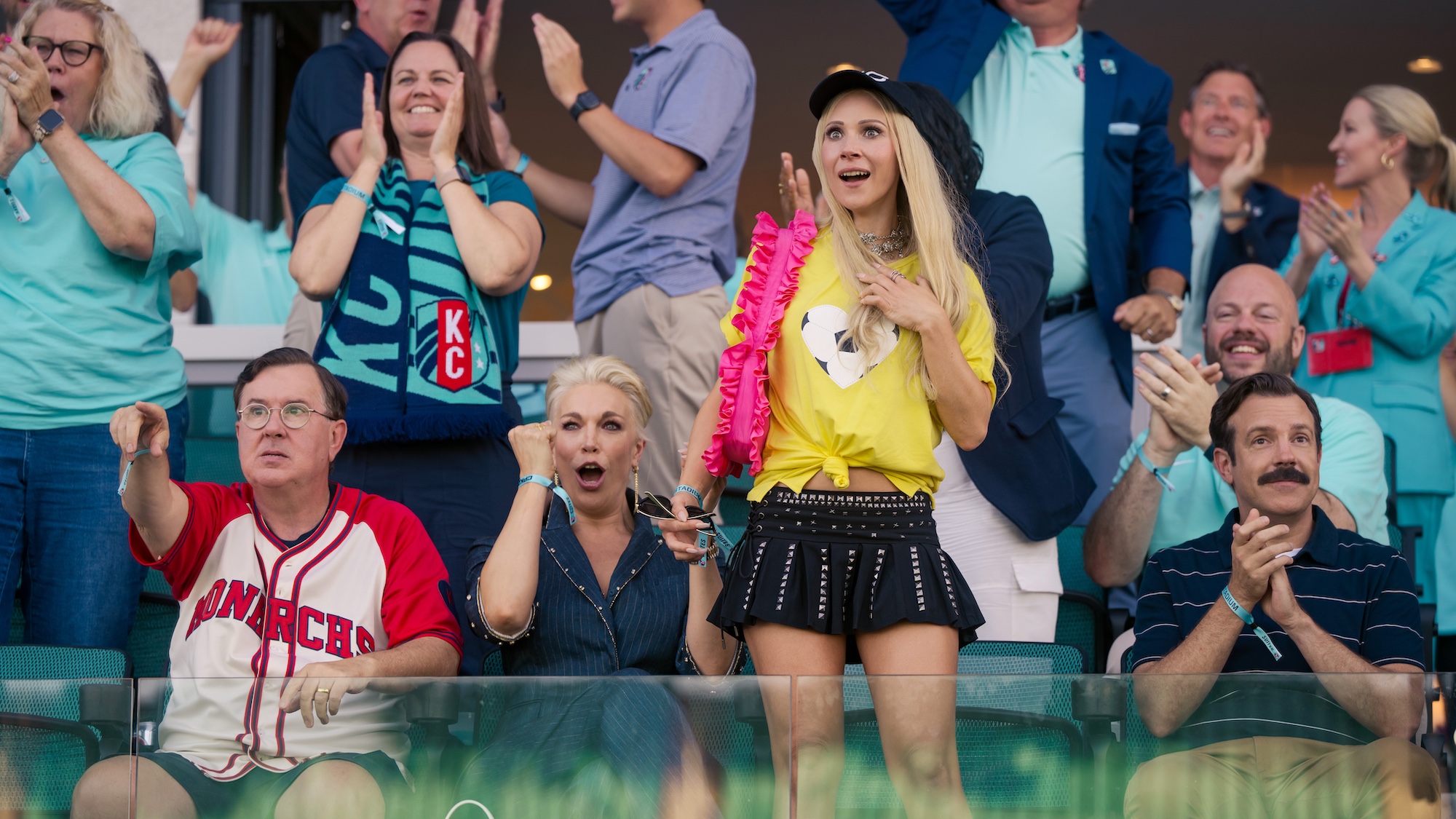 Ted, Keely, Rebecca, and Higgins watching a game in the Season 4 premiere. 