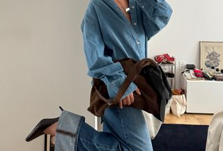 woman in denim shirt and jeans