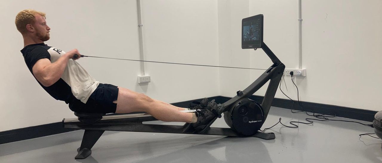 Hydrow Wave rowing machine being tested by our reviewer.