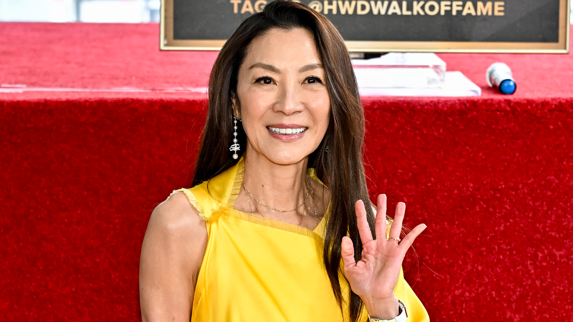 Michelle Yeoh attended her Hollywood Walk of Fame ceremony in a yellow satin dress from Dior