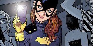 batgirl taking a selfie, with joss whedon