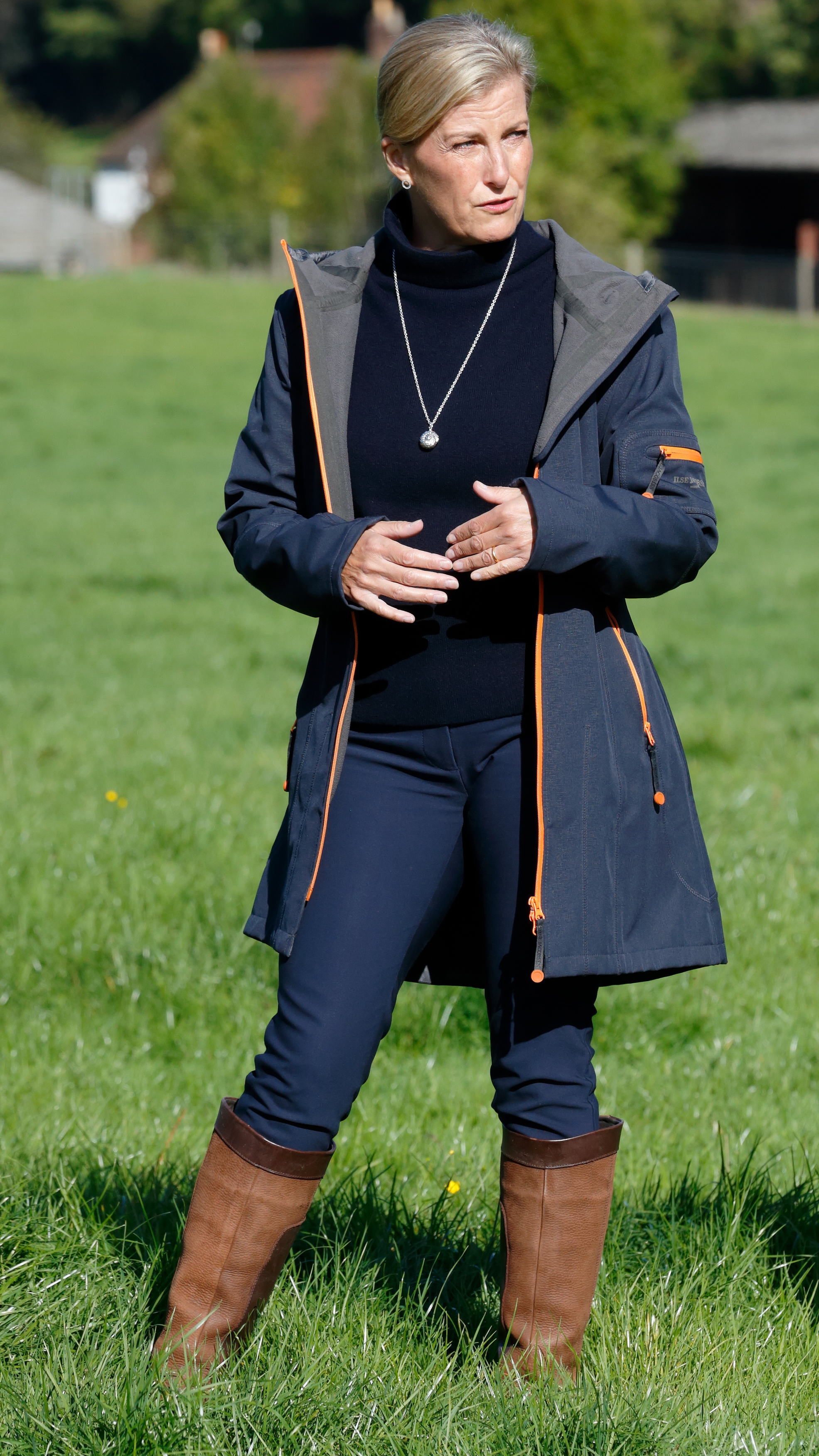 Sophie, Duchess of Edinburgh stands listening as she visits Coverwood Farm on September 24, 2020