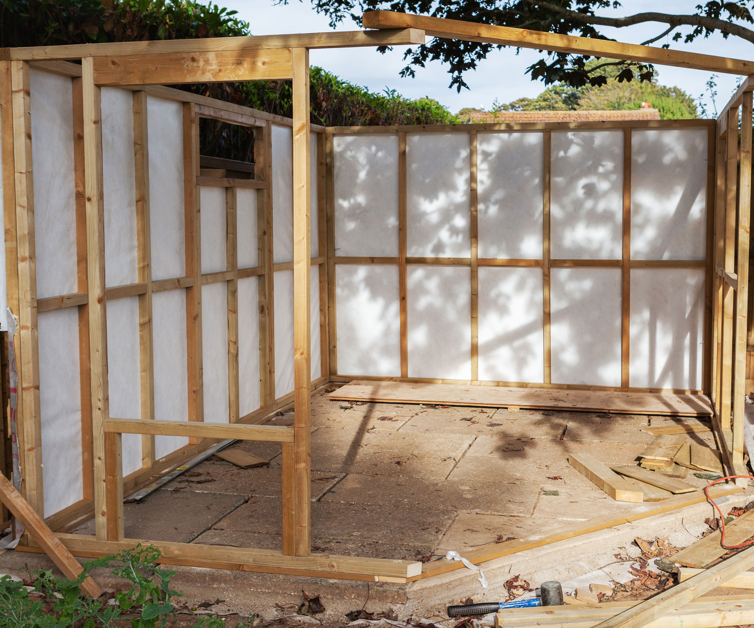 shed in garden being constructed with wooden base