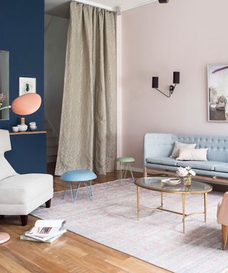 Living room pictures showing a pastel color scheme with pale blue sofa and pale pink walls.