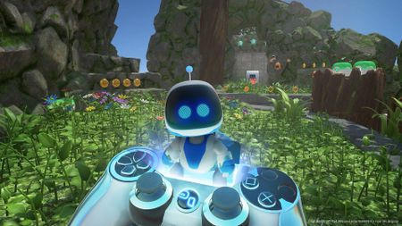 Astro Bot Rescue Mission screenshot shows Astro Bot popping out of a controller.