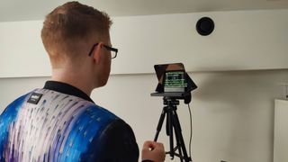 Man presenting to camera while using the Elgato Prompter