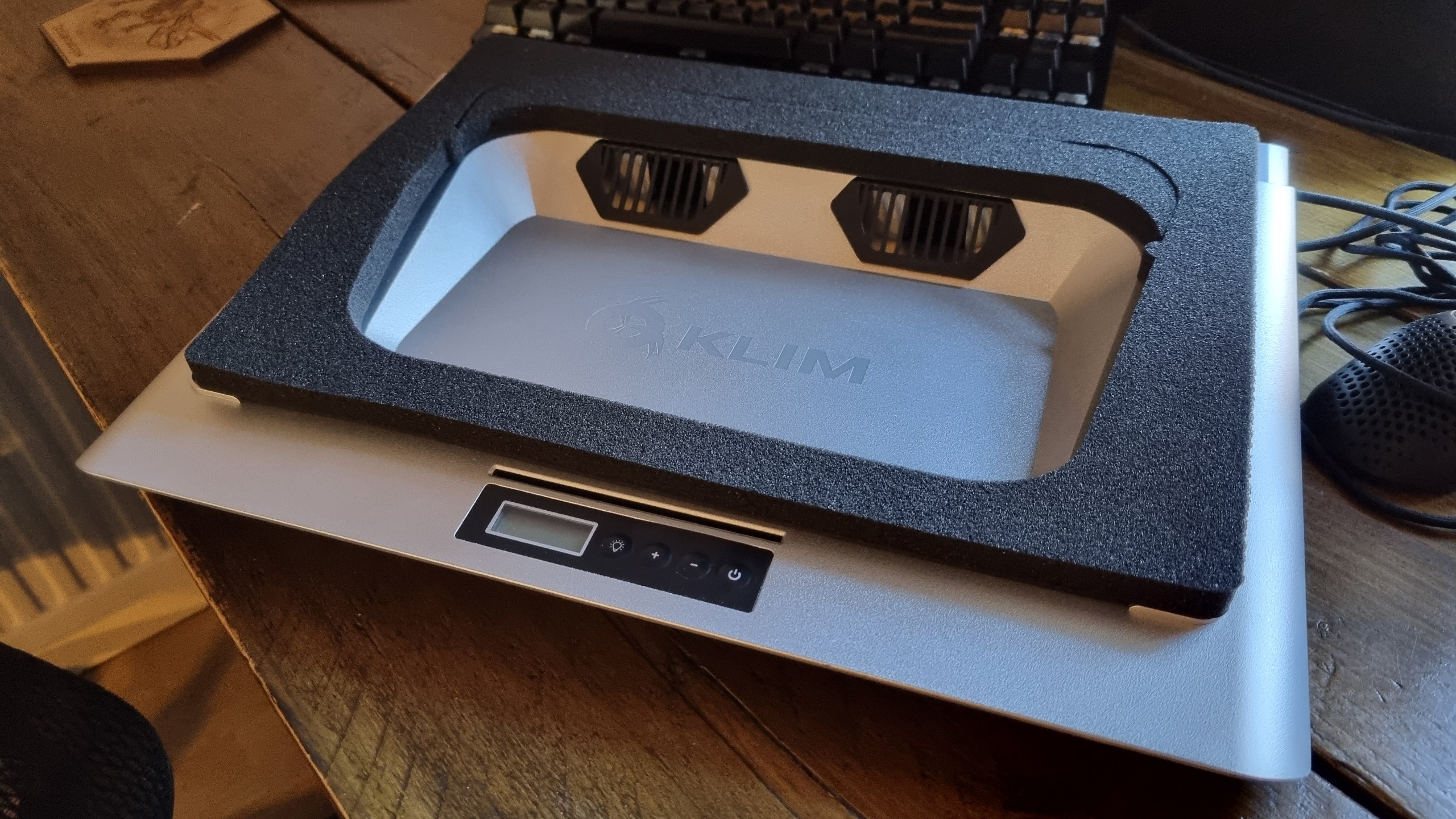 Assorted images of the Klim Everest laptop cooler, and everything included inside the box