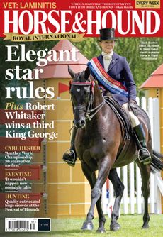 Cover of Horse and Hound featuring Boston Black Tie, a black horse ridden by Helen Barker who wears a top hat, navy blue coat and supreme champion sash
