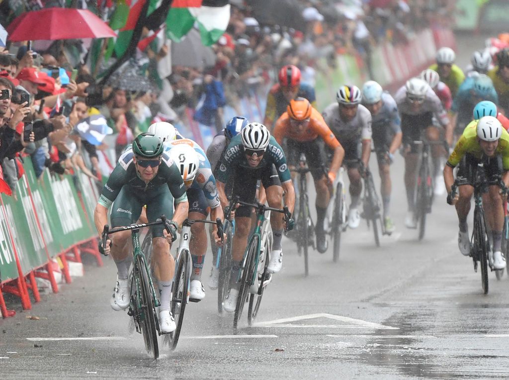 Team Alpecin's Kaden Groves (L) competes ahead of the finish line of the stage 17 of the Vuelta a Espana, a 141,5 km race between Arnuero and Santander, on September 4, 2024. (Photo by Ander Gillenea / AFP)