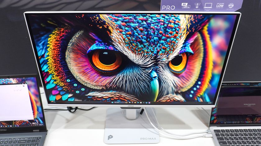 The MSI PRO MAX 271UPXW12G monitor hooked up to a MacBook and a Windows laptop at CES 2026