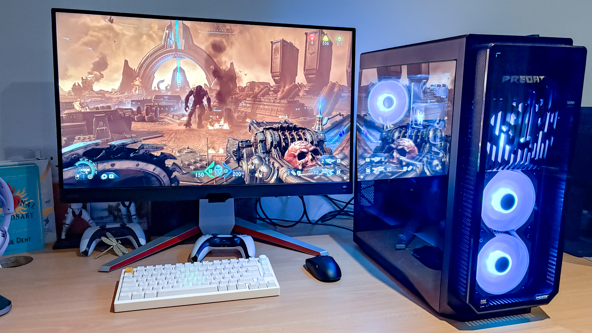 Acer Predator Orion 7000 with Doom The Dark Ages game on monitor with keyboard, mouse and PS5 controller on desk