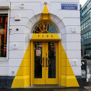 door with yellow and white wall
