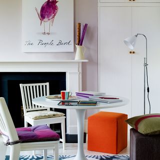 light lilac office room with rounded table and chair