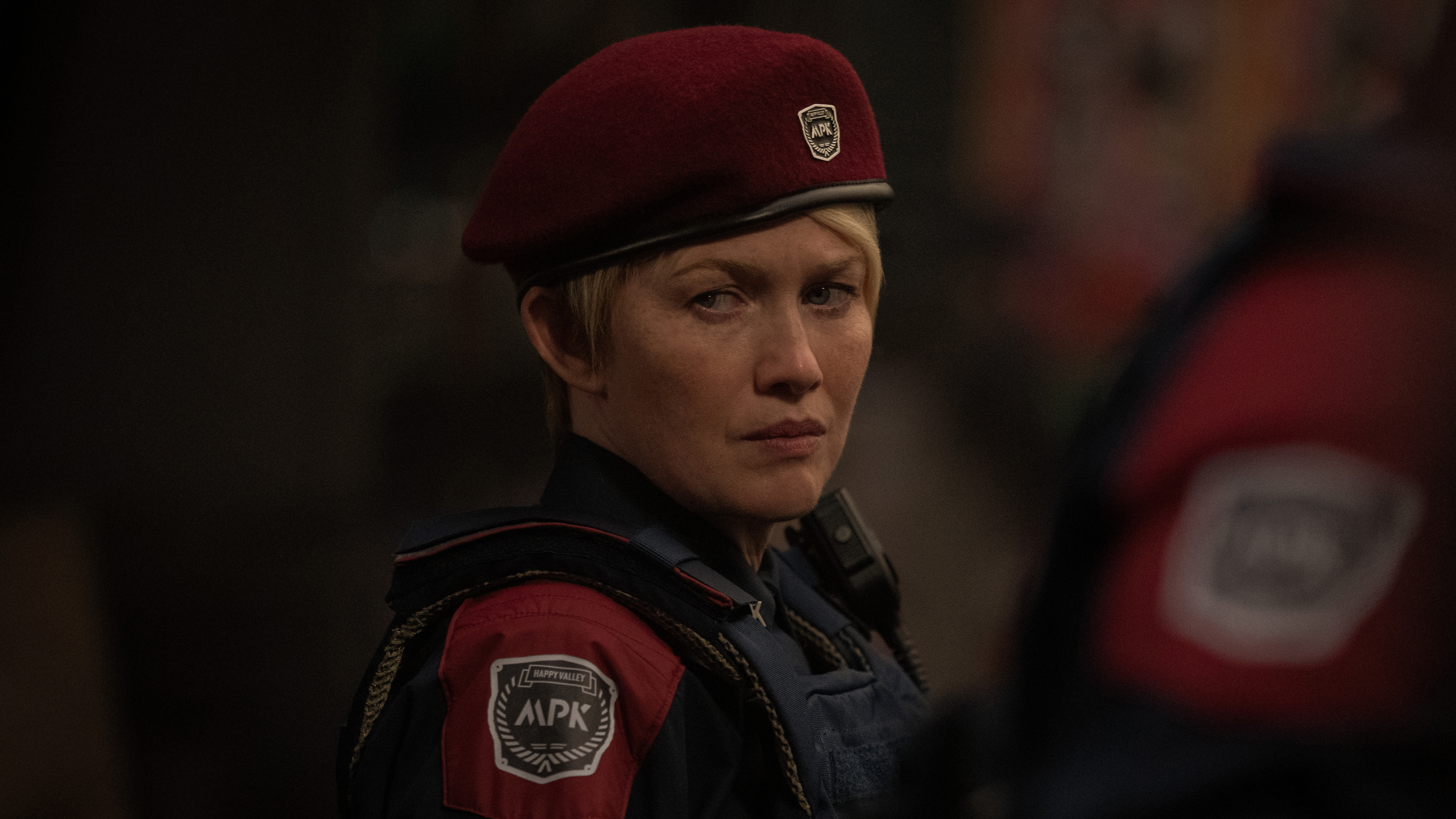 Mireille Enos in an early teaser image from For All Mankind season 5, she is wearing a red beret and looking pensively off camera
