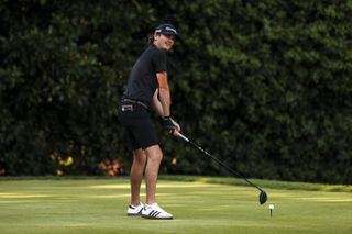 Mac Boucher lines up a tee shot with an upside down driver