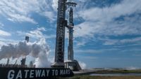 SpaceX's Starship Flight 12 Ship and Super Heavy booster on the pad by a Gateway to Mars sign.