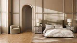A roomy bedroom in neutral colors, featuring a chair, nightstands, table lamps, bedding, bed frame, and mattress all made by Saatva