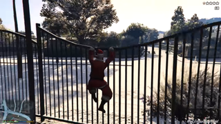 Santa climbing a fence