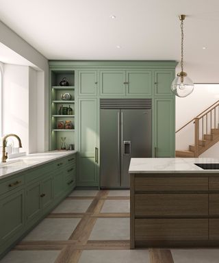 Sage green kitchen with sage green cabinets and dark wood contrast island