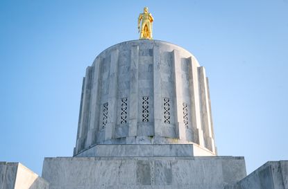 Oregon State Capitol building against a bright blue sky