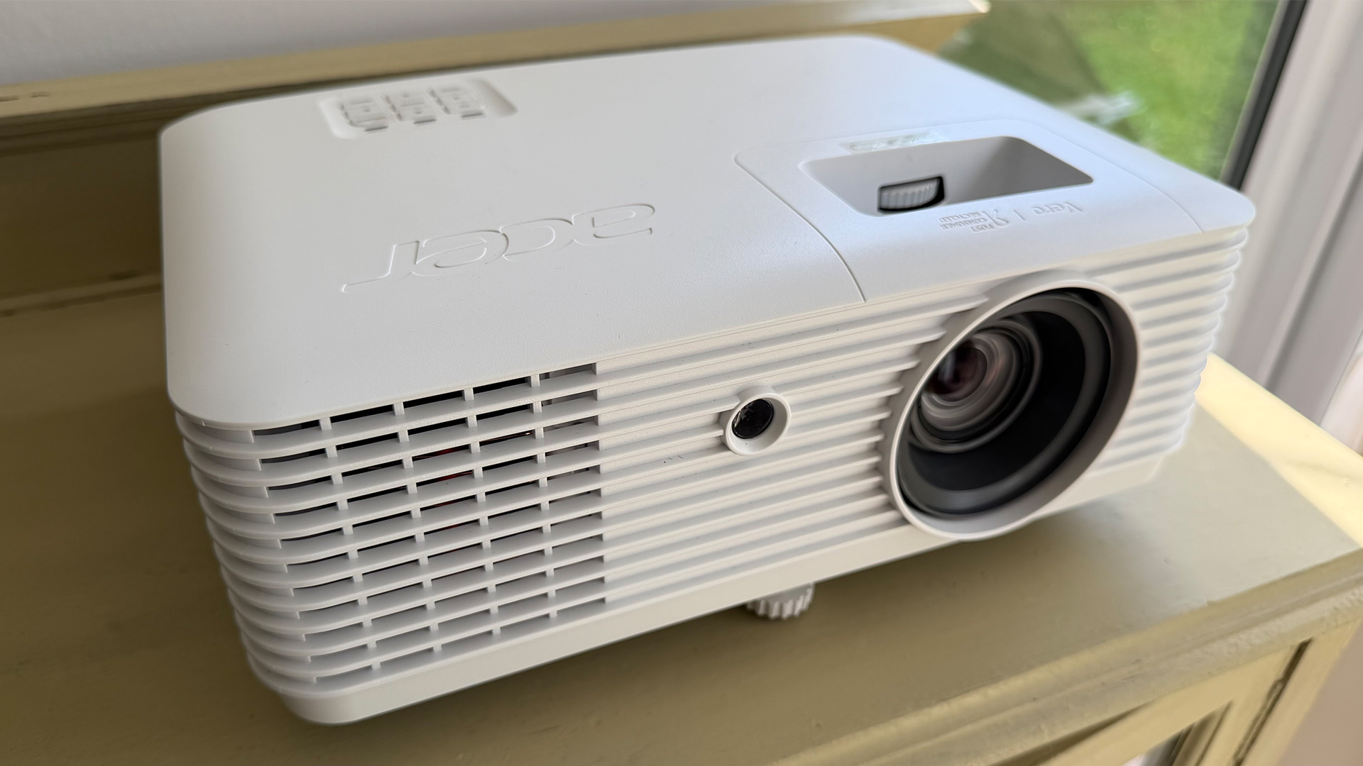 Acer Vero HL6810ATV home cinema projector on wooden furniture