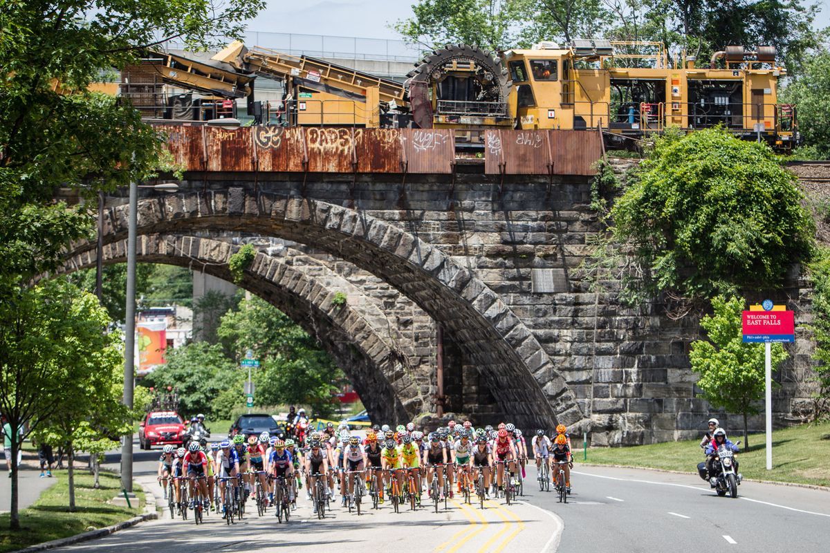 The women's field bunch up with a break up the road.