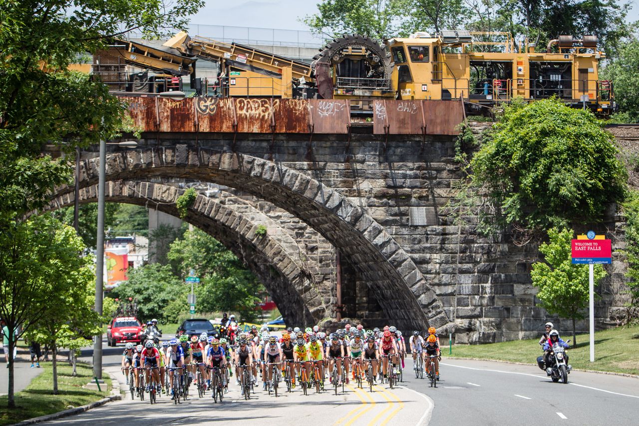 The women's field bunch up with a break up the road.