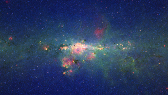 A view from the bustling center of our galactic metropolis. Spitzer Space Telescope offers us a fresh, infrared view of the frenzied scene at the center of our Milky Way, revealing what lies behind the dust.