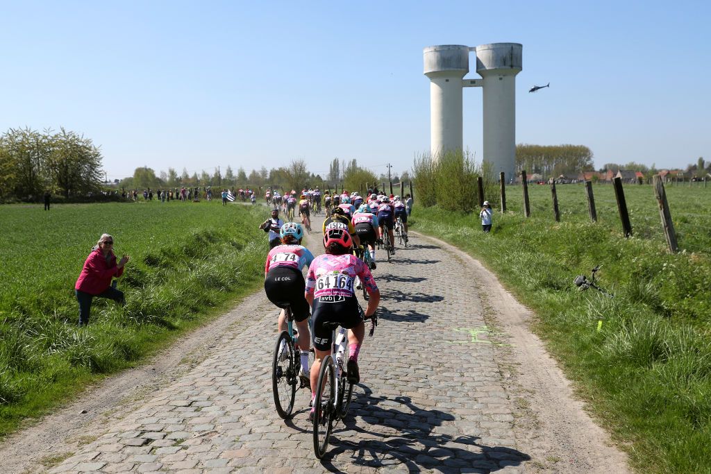 ROUBAIX FRANCE APRIL 16 Magdeleine VallieresMill of Canada and Team EF Education Tibco Svb and the peloton passing through a cobblestones sector during the 2nd ParisRoubaix 2022 Womens Elite a 1247km one day race from Denain to Roubaix ParisRoubaixFemmes ParisRoubaix on April 16 2022 in Roubaix France Photo by Etienne Garnier PoolGetty Images