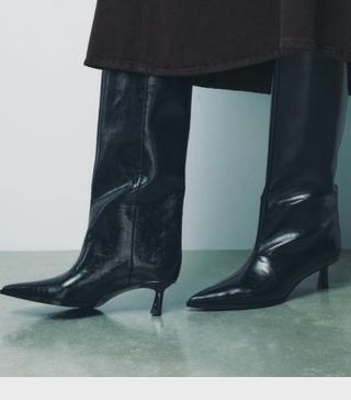 Image of black patent boots