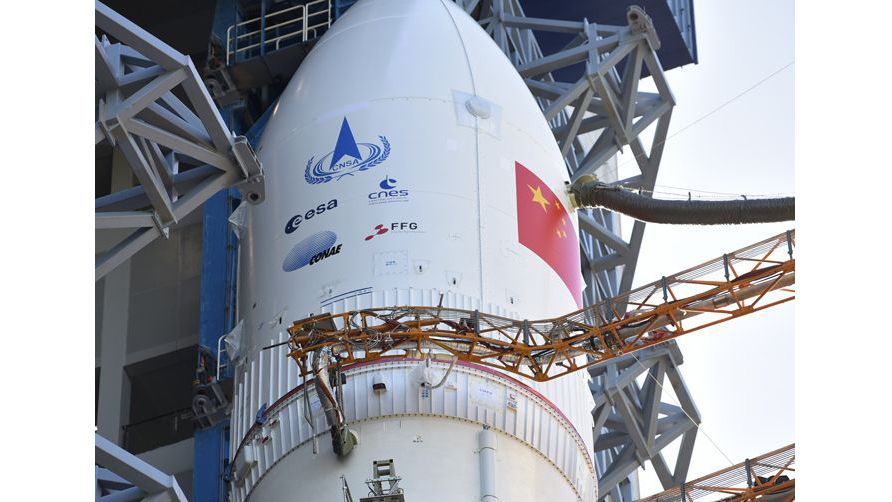 A Long March 5 rocket was vertically transported to the launch area at China&rsquo;s Wenchang Space Launch Center on July 17, 2020. Note the logos of the European (ESA), French (CNES), Argentine (CONAE) and Austrian (FFG) space agencies in addition to that of the China National Space Agency (CNSA).