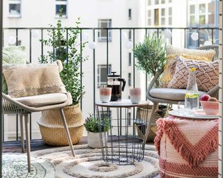 Wayfair balcony with rug and chairs