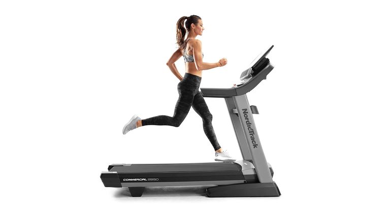 NordicTrack Commercial 2950 treadmill review: image shows woman running on NordicTrack Commercial 2950 treadmill 
