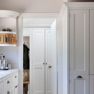 White Shaker style kitchen leading on to boot room