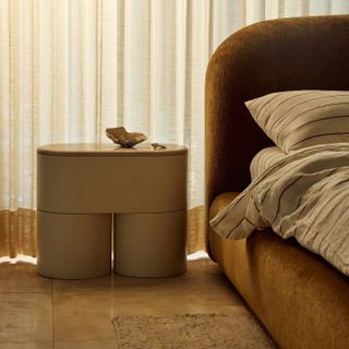 bedside table with chunky cylindrical legs