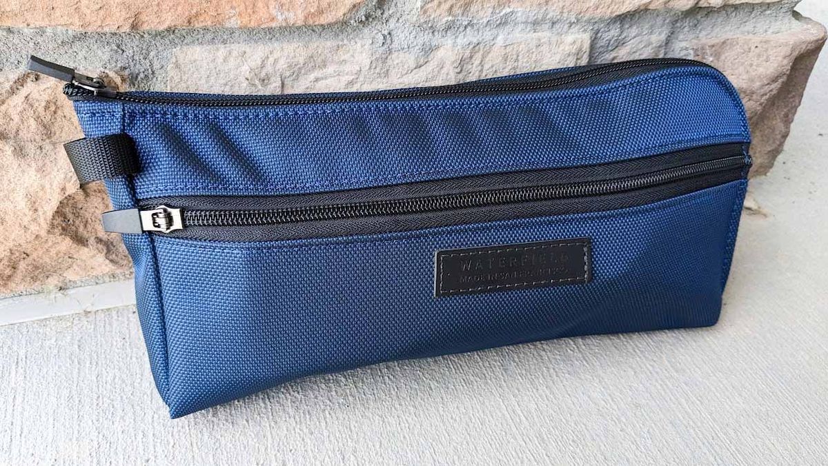 WaterField Pouch with ROG Ally and charging cable inside.
