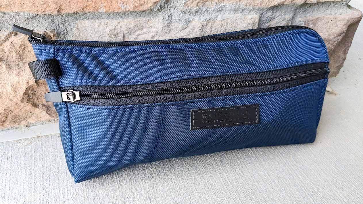 WaterField Pouch with ROG Ally and charging cable inside.