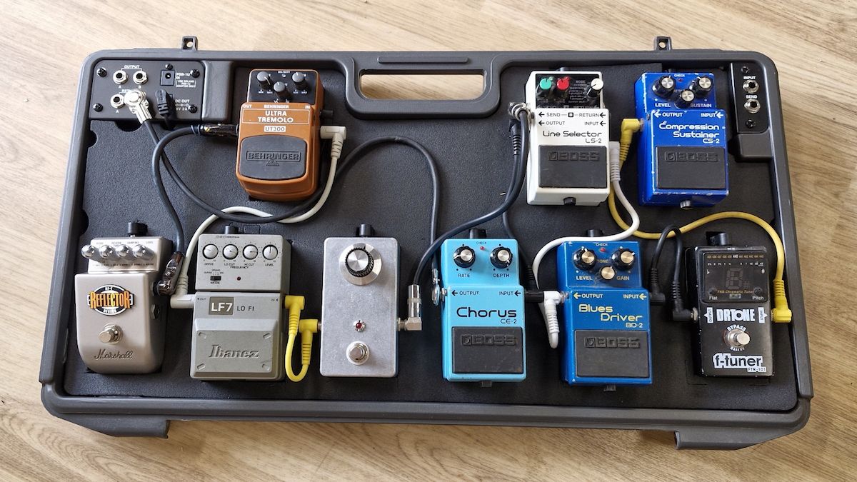 A Boss BCB-90X pedalboard with various pedals atttached