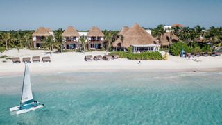 Relax at one of the thatched beach cabanas on the hotel's private beach