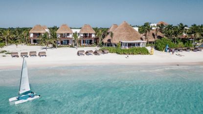 Relax at one of the thatched beach cabanas on the private beach 