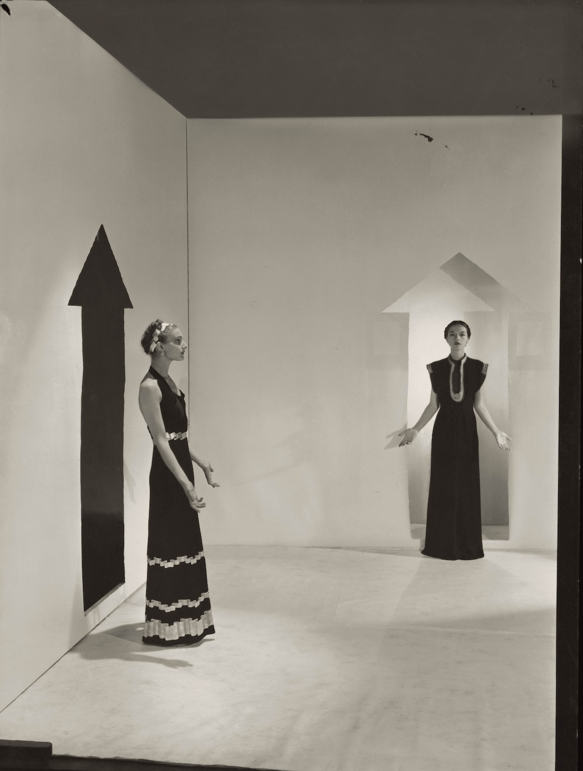 Vogue 1936; Two models wearing dresses by Schiaparelli