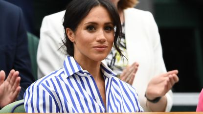 Meghan, Duchess of Sussex attends day twelve of the Wimbledon Lawn Tennis Championships at All England Lawn Tennis and Croquet Club on July 14, 2018 in London, England