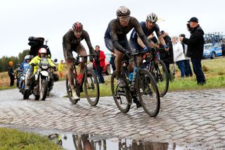 ROUBAIX FRANCE OCTOBER 03 LR Vegard Stake Laengen of Norway and UAE Team Emirates Matteo Jorgenson of United States and Movistar Team and Davide Ballerini of Italy and Team Deceuninck QuickStep compete through cobblestones sector during the 118th ParisRoubaix 2021 Mens Eilte a 2577km race from Compigne to Roubaix ParisRoubaix on October 03 2021 in Roubaix France Photo by Bas CzerwinskiGetty Images