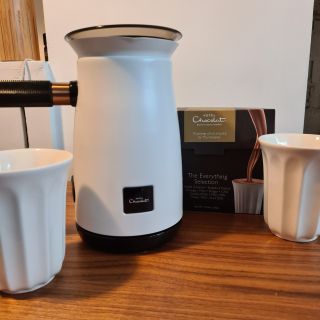 Hotel Chocolat Velvetiser standing on kitchen counter with two mugs