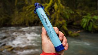 Person holding LifeStraw Personal Water Filter