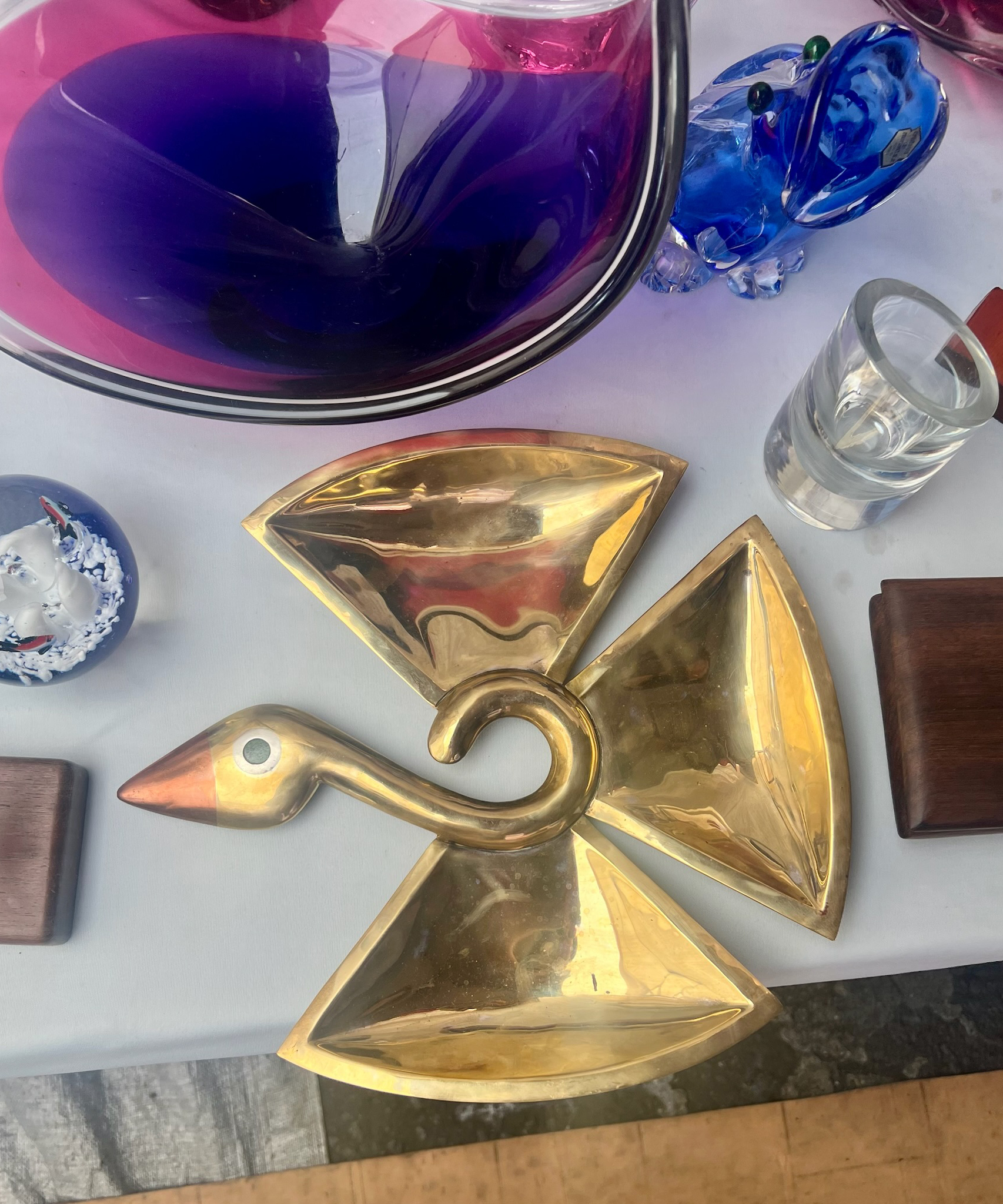 market stall with gold metal swan ash tray and vintage glass