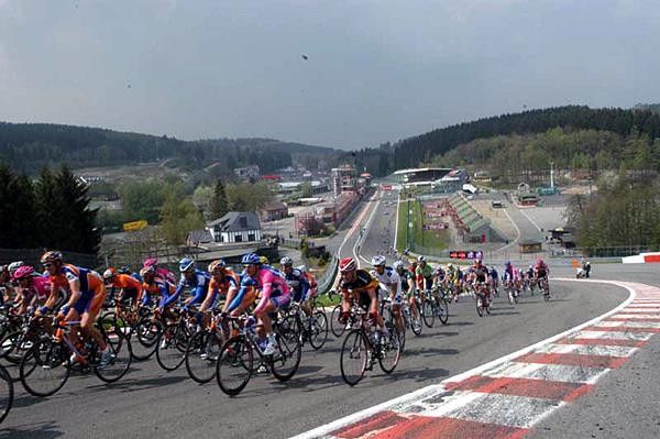 A long peloton on the race track at Spa-Francorchamps