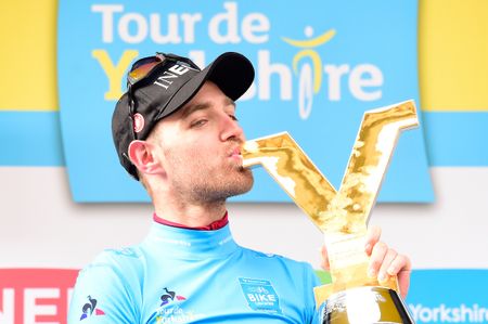 Lawless kisses his trophy as winner of the 2019 Tour de Yorkshire